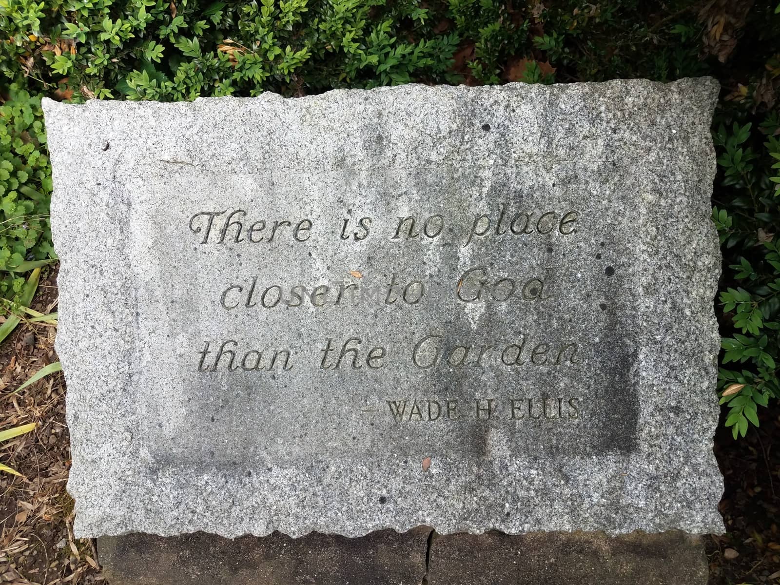 there is no place closer to God than the garden quote on stone by stockphotofan1