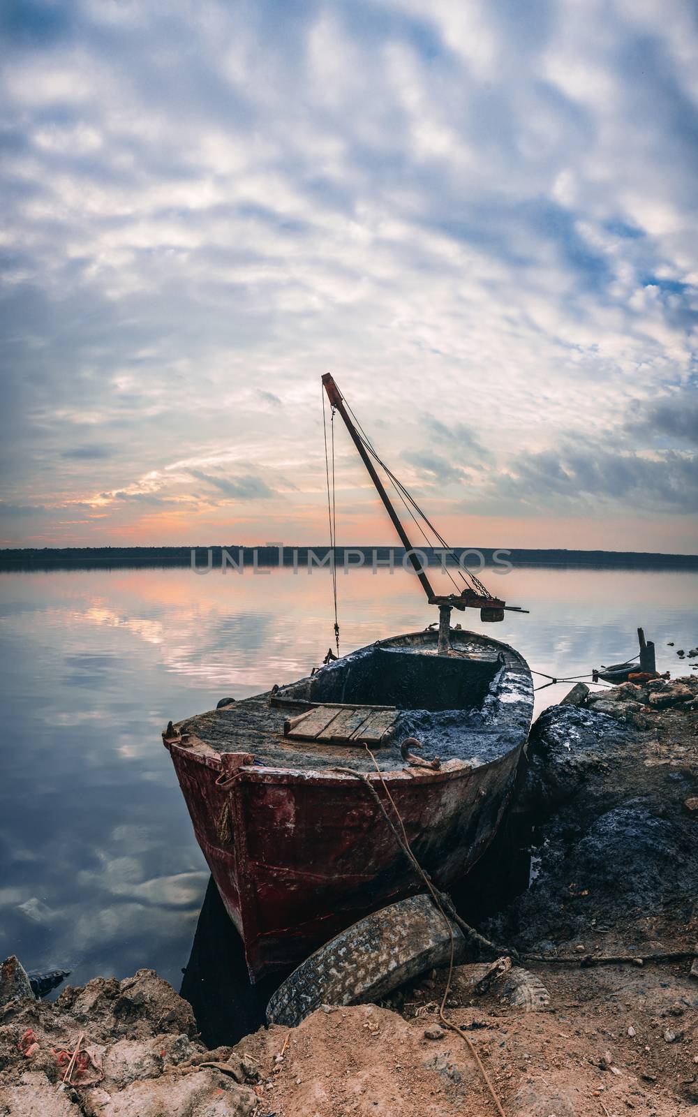 Old boat of the mud getters on the salt lake Kuyalnik in Odessa, Ukraine