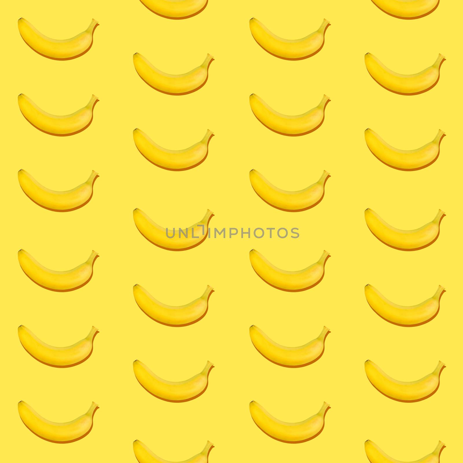 Seamless pattern of fresh ripe yellow bananas on yellow background