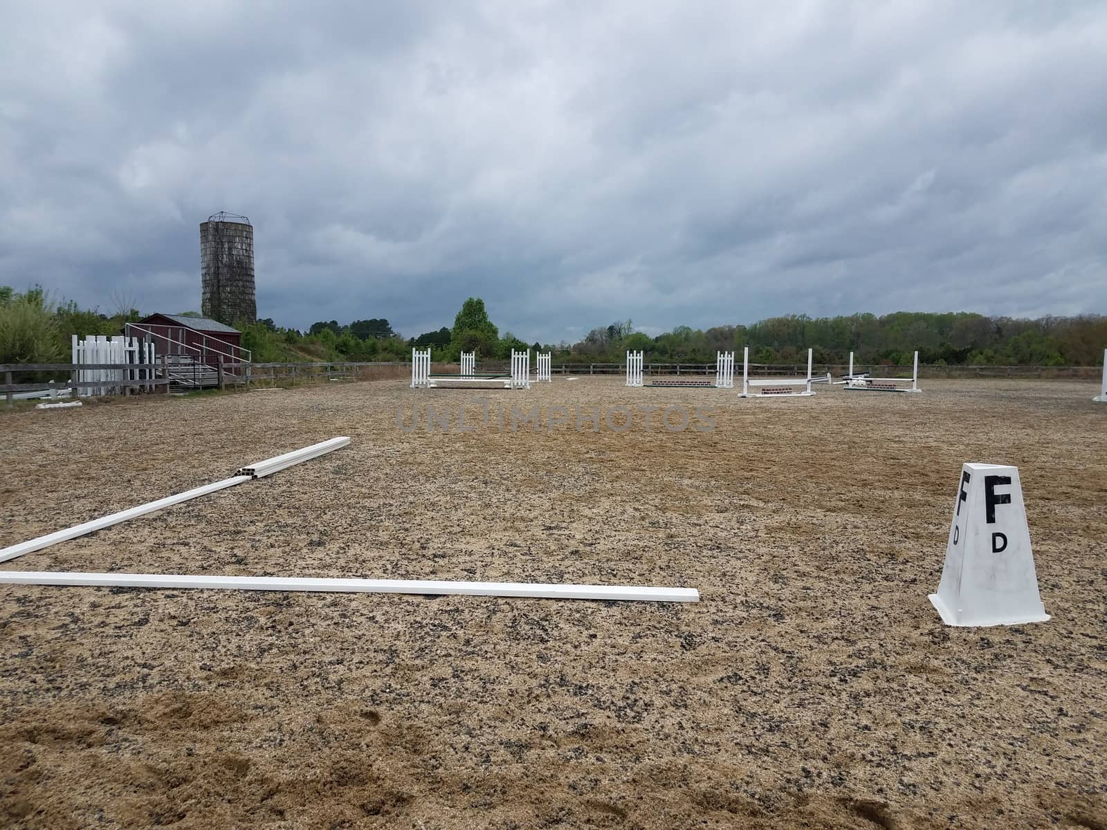 metal railings and sand or dirt at equestrian field by stockphotofan1