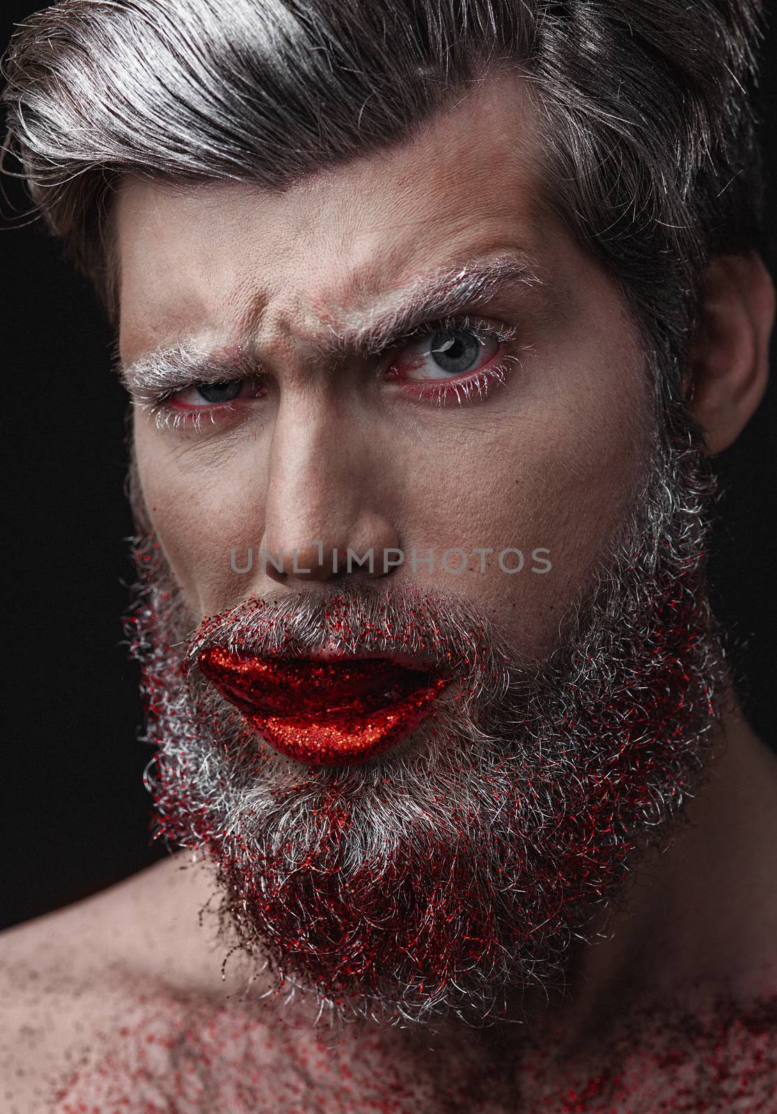 Creative Portrait of grey-haired fashionable man with red lips and tongue