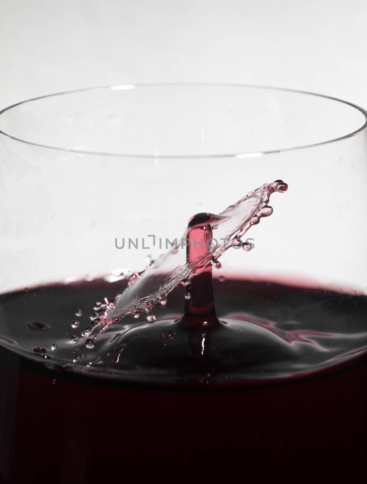 Wine Drops Collide Inside Glass by CharlieFloyd