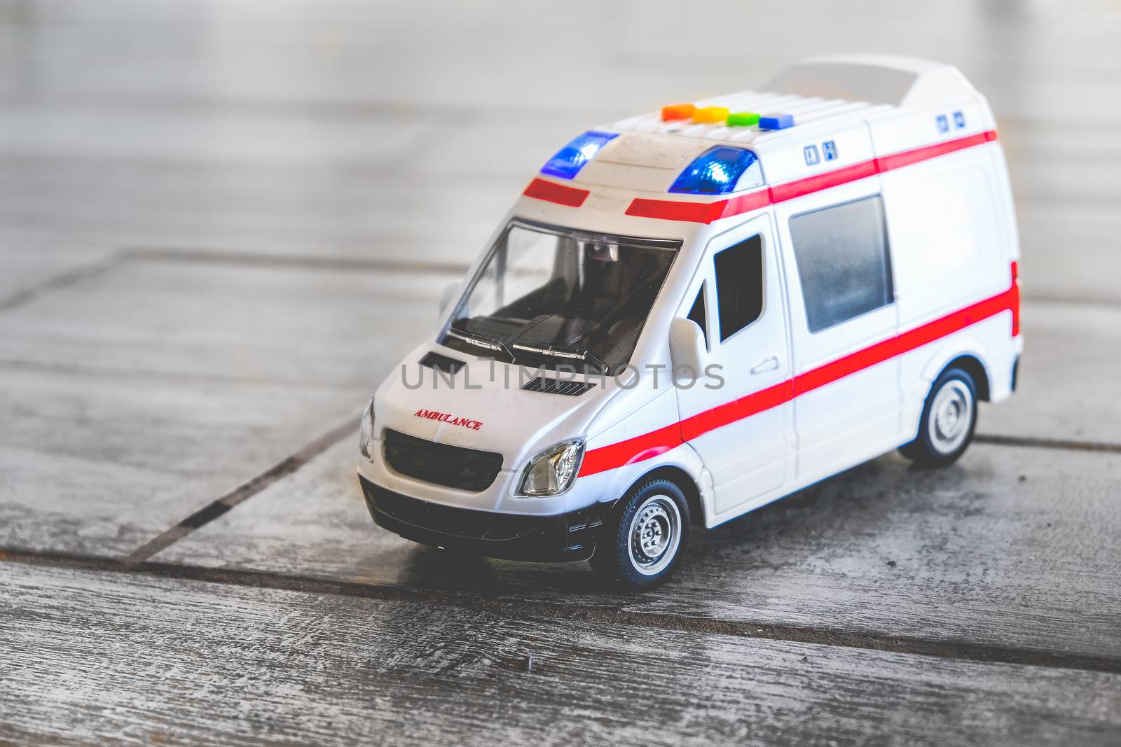 ambulance background toy medical health care vehicle sirens blue lights .