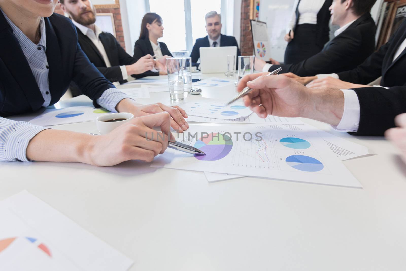 Co working conference, Business team meeting , colleagues discussing financial graph data on office table with laptop and digital tablet, Finance, accounting, investment.