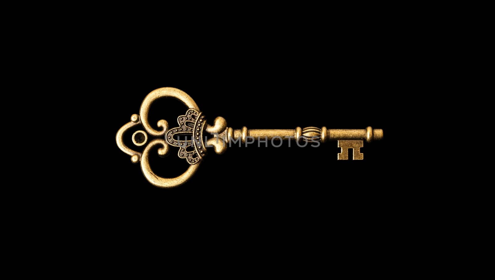 Old bronze key isolatrd on a black background. With clipping path