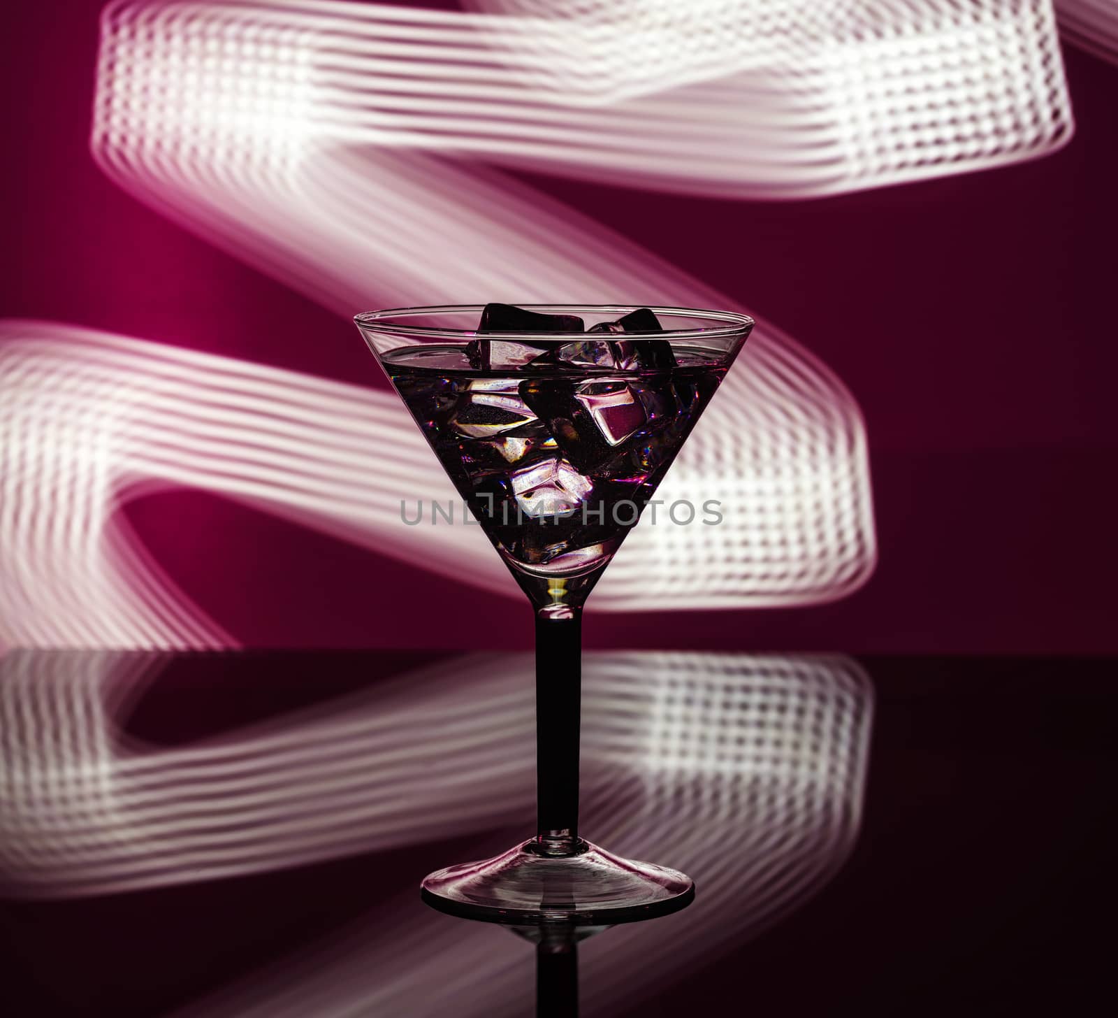 A glass of martini with club background by dmitry_derenyuk