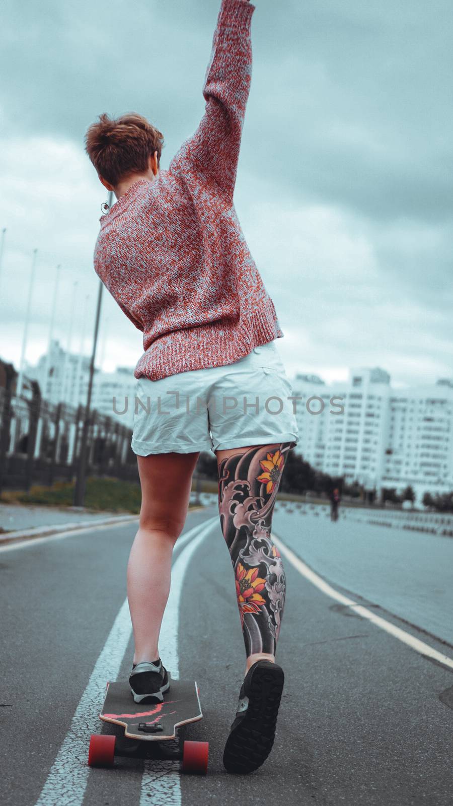 Beautiful young girl with tattoos with longboard by natali_brill