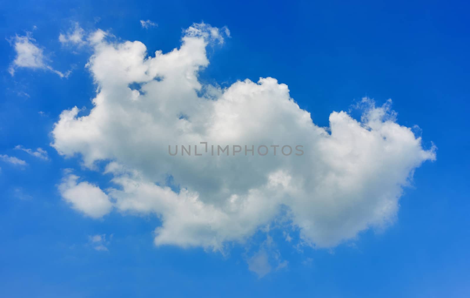 White fluffy cloud on blue sky as a background with copy space.