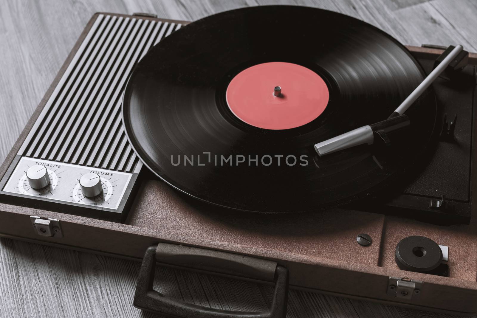 Black vinyl record on record player by Robertobinetti70