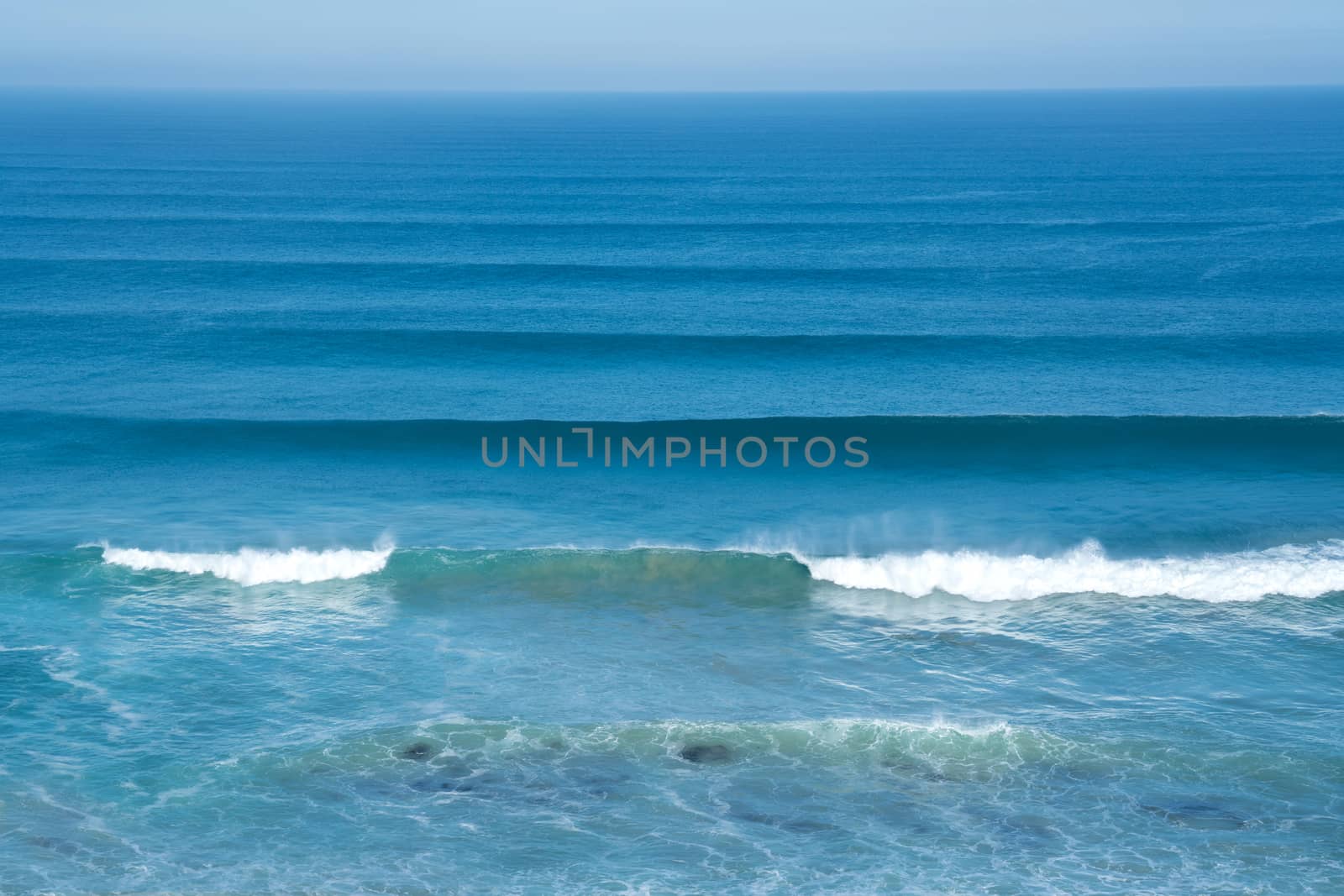 scene of the ocean with small waves