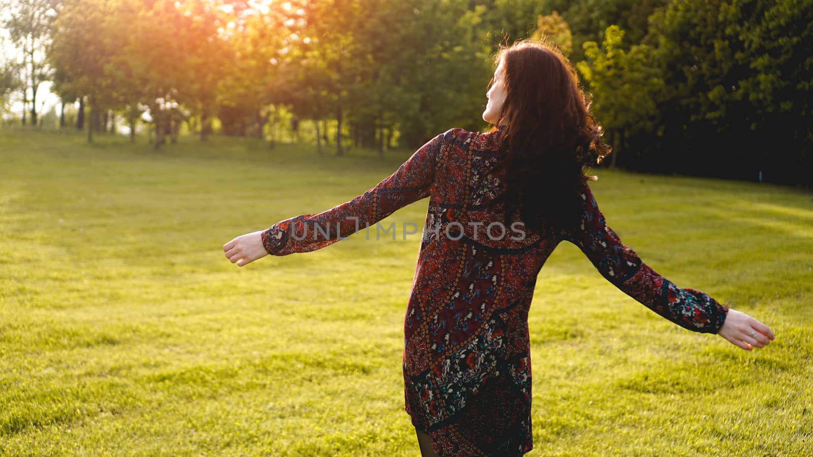 Attractive young woman enjoying her time outside in park - summer time