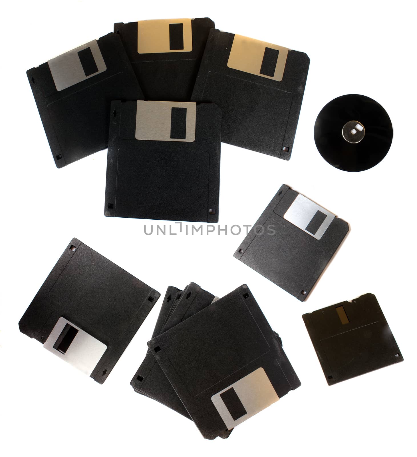 Old floppys used for computer storage in 80s and 90s, on white studio background