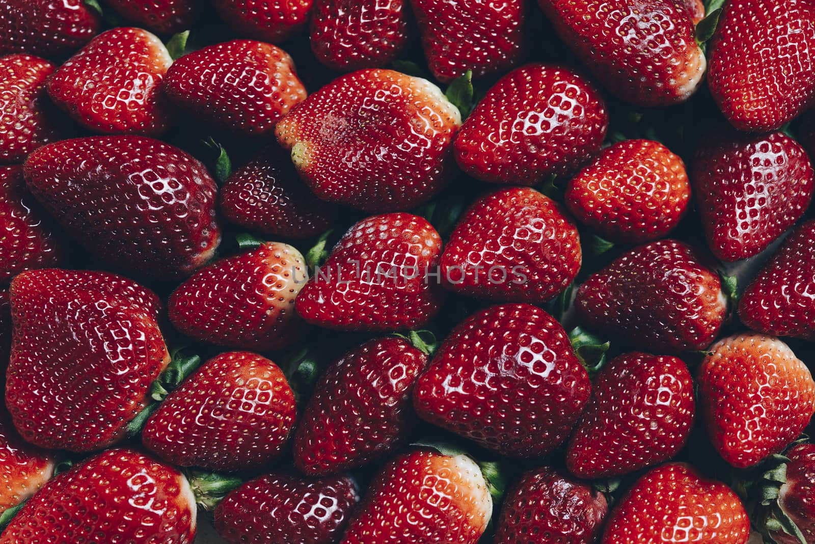 background image of red strawberries seen from above, healthy sweet food, vitamins and fruity concept. Food frame background, flat lay, top view point