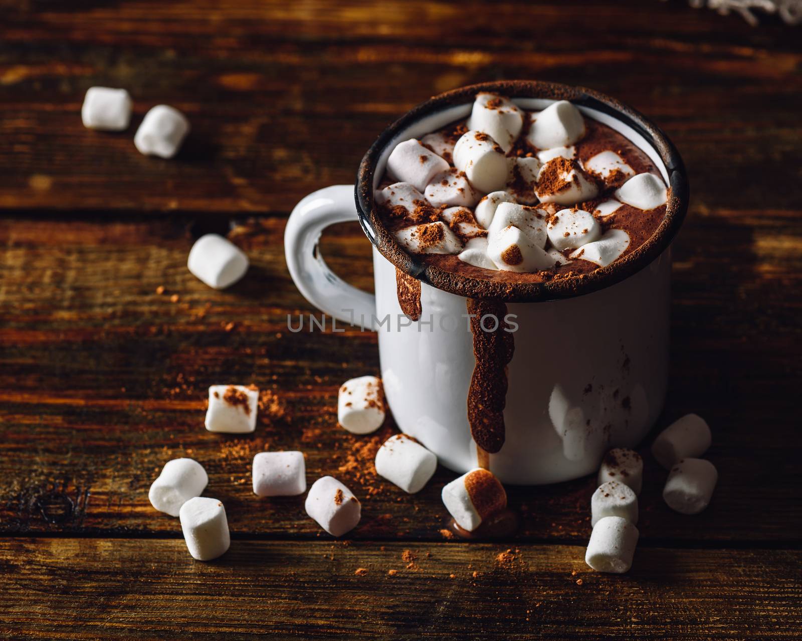 Cocoa Mug with Marshmallows. Some Marshmallow and Cocoa Powder Scattered on Wooden Table.