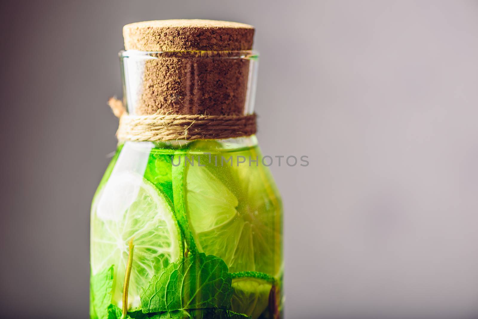 Bottle with Water Flavored with Lime and Mint. by Seva_blsv
