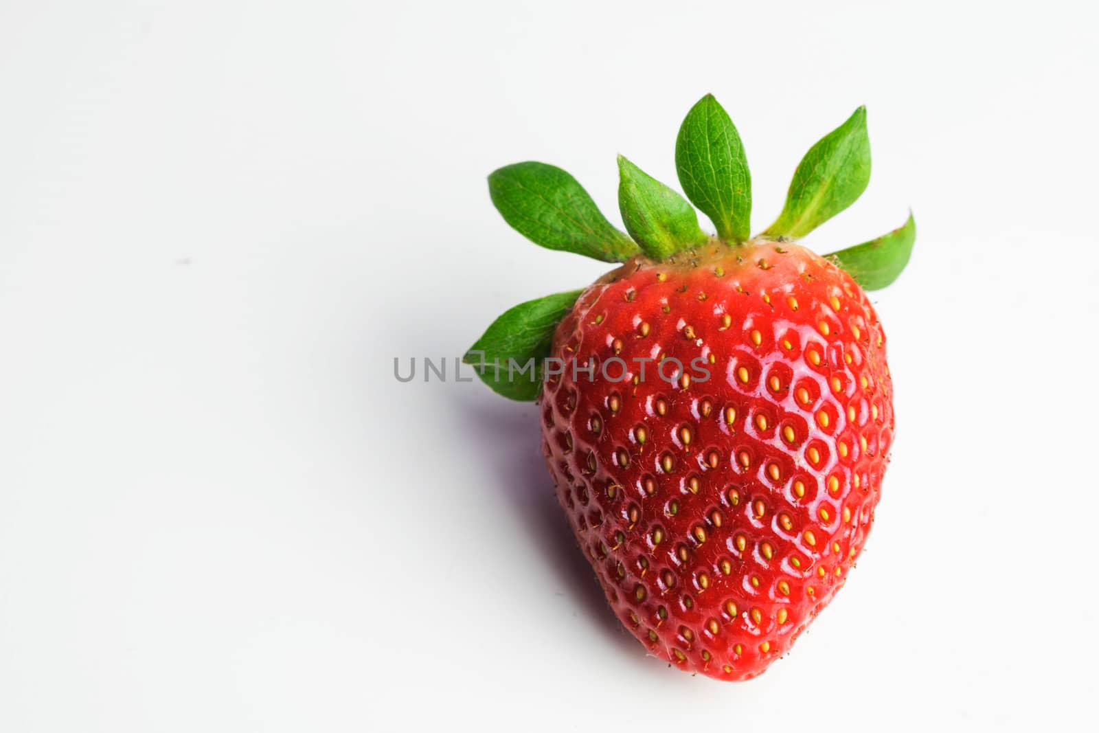 Isolated raw strawberry on a white background