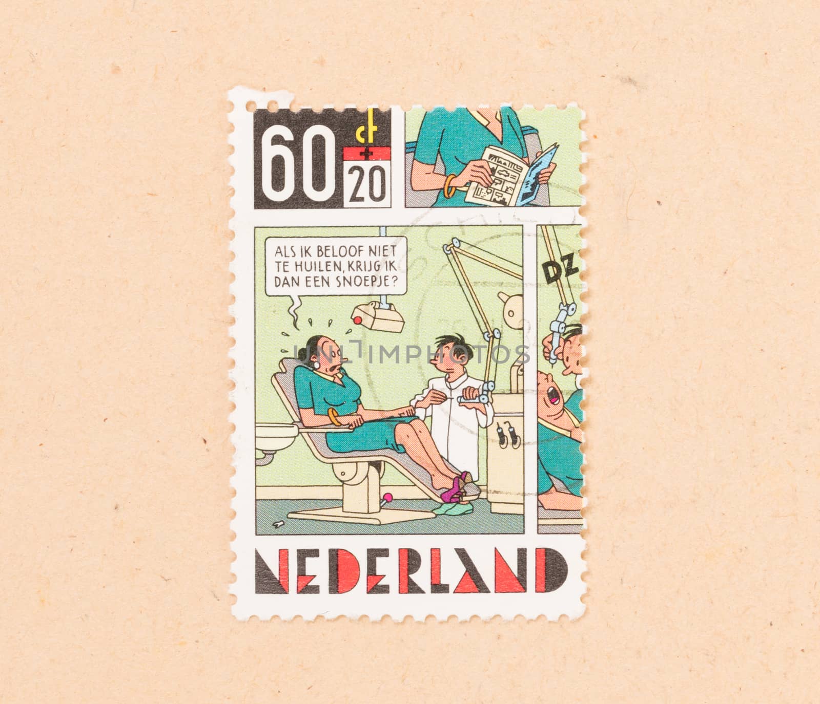 THE NETHERLANDS 1980: A stamp printed in the Netherlands shows a drawing of a patient and a dentist, circa 1980
