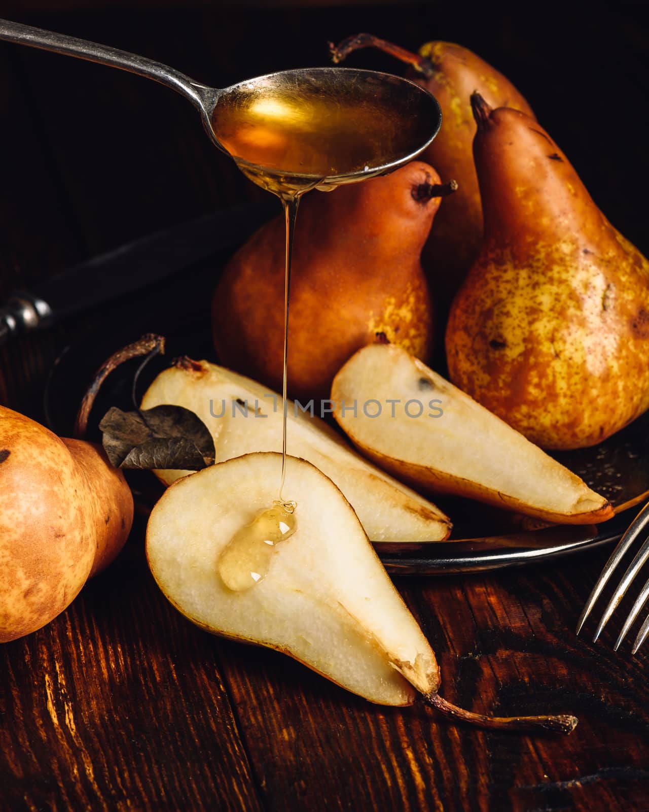 Golden Pears with Sliced One and Spoonful of Honey.