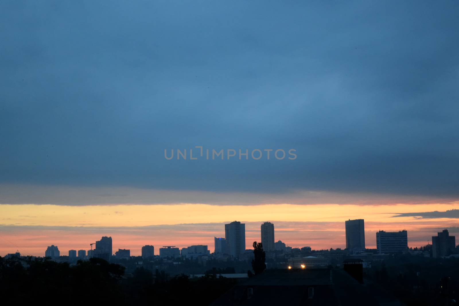 sunset over city, round red sun and the night by IaroslavBrylov