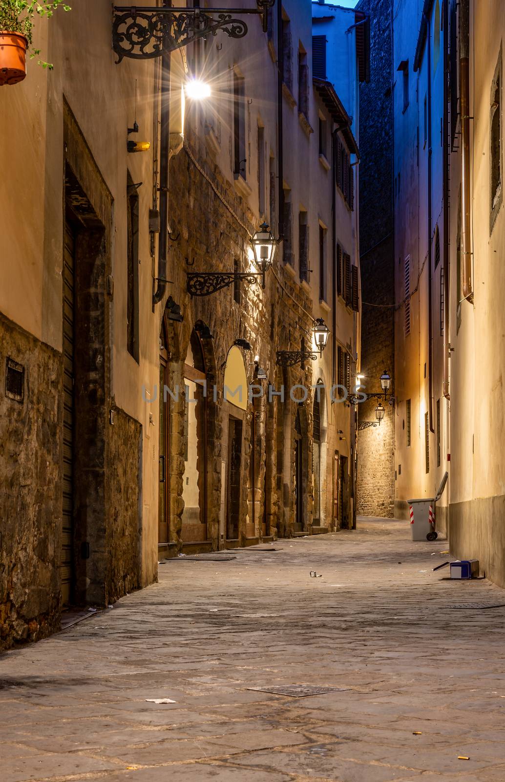 Narrow street of Florence illuminated at night