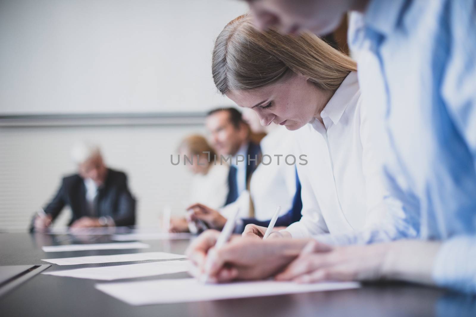 Business people working with documents in conference room