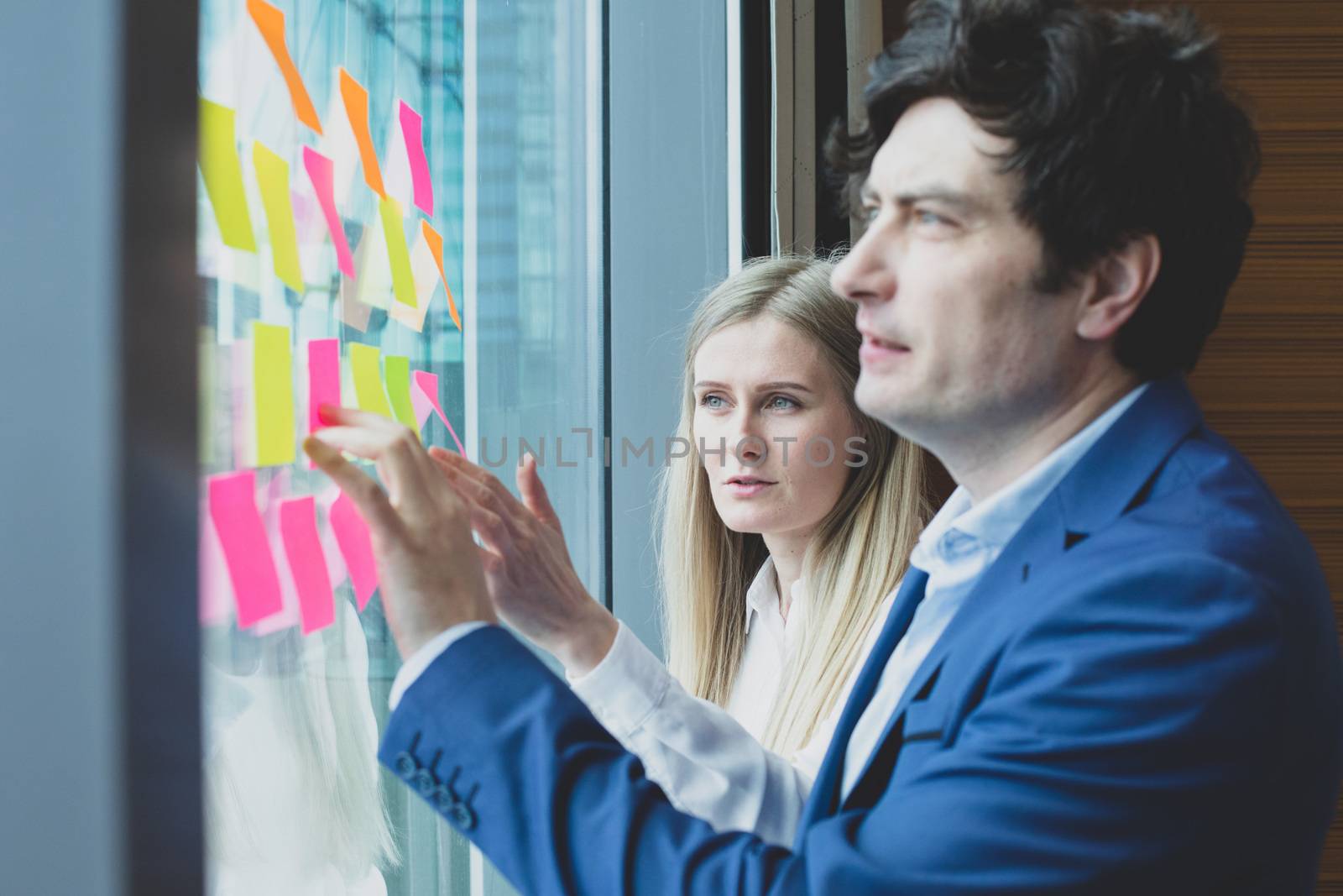 Group of business people brainstorming ideas. Entrepreneurs having a standing meeting discussing ideas strategy planning problem solution concept