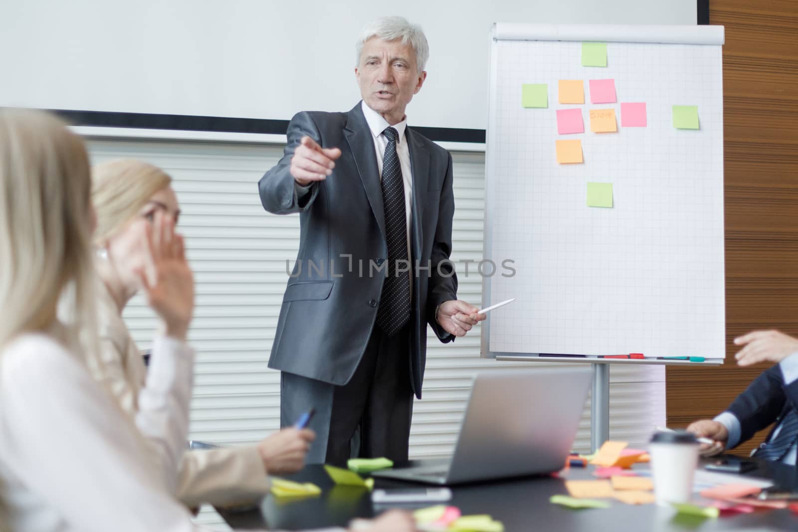 Team at business meeting in office planning creative with sticky notes