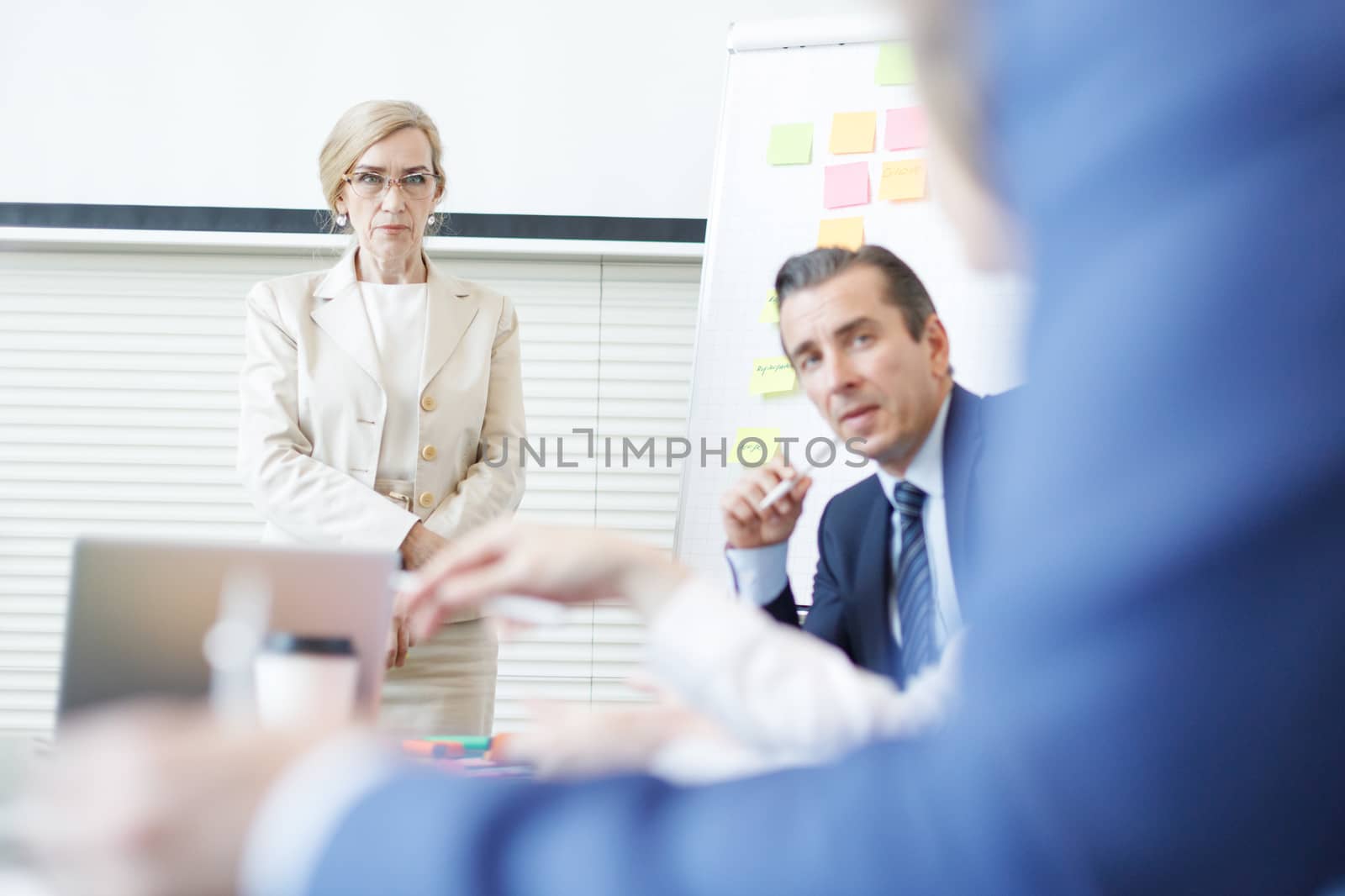 Team at business meeting in office planning creative with sticky notes