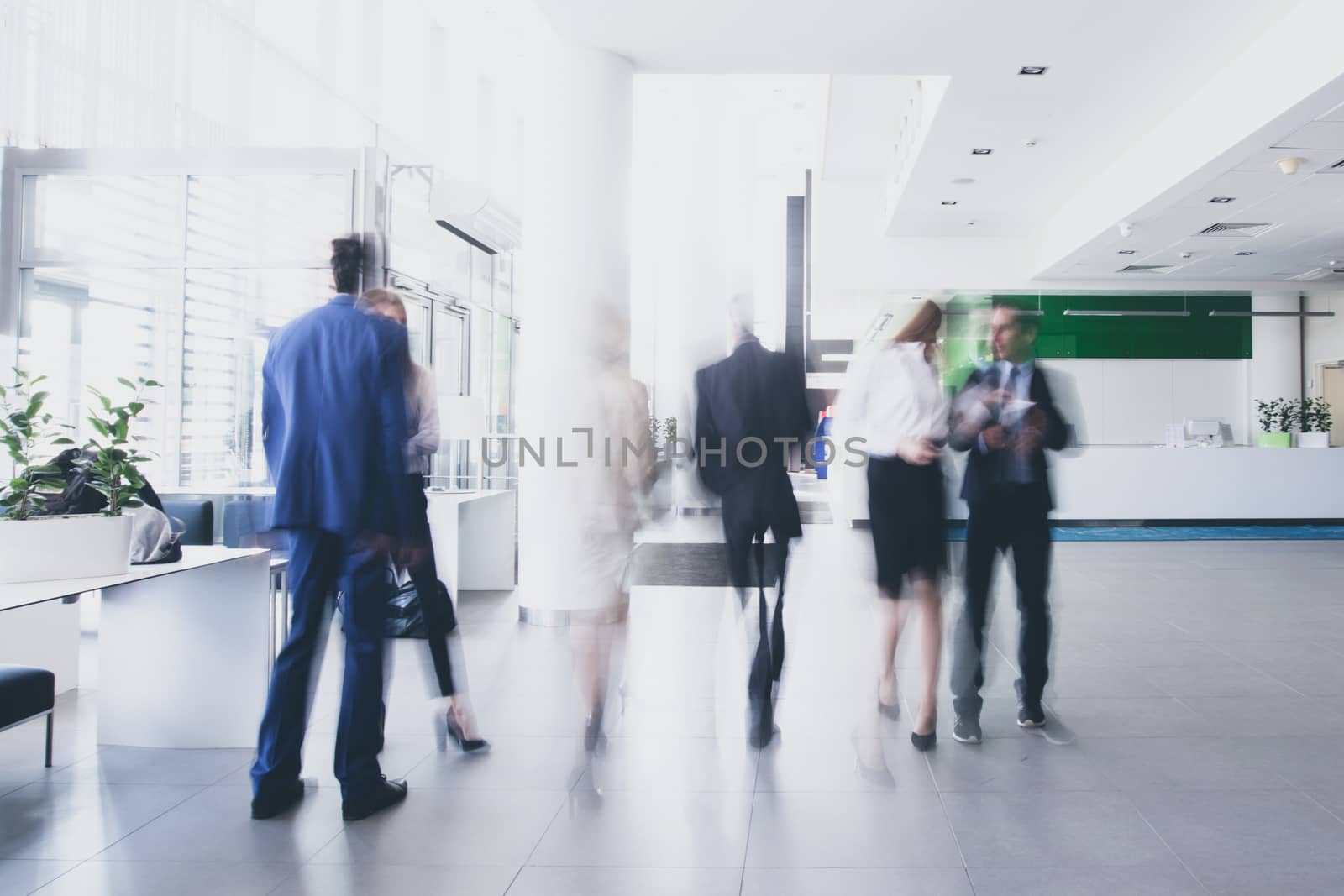 Businesspeople walking in corridor by ALotOfPeople