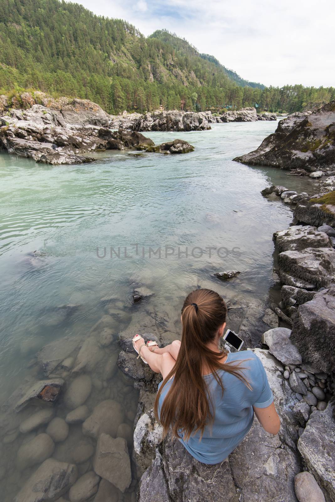 Woman resting at river by rusak