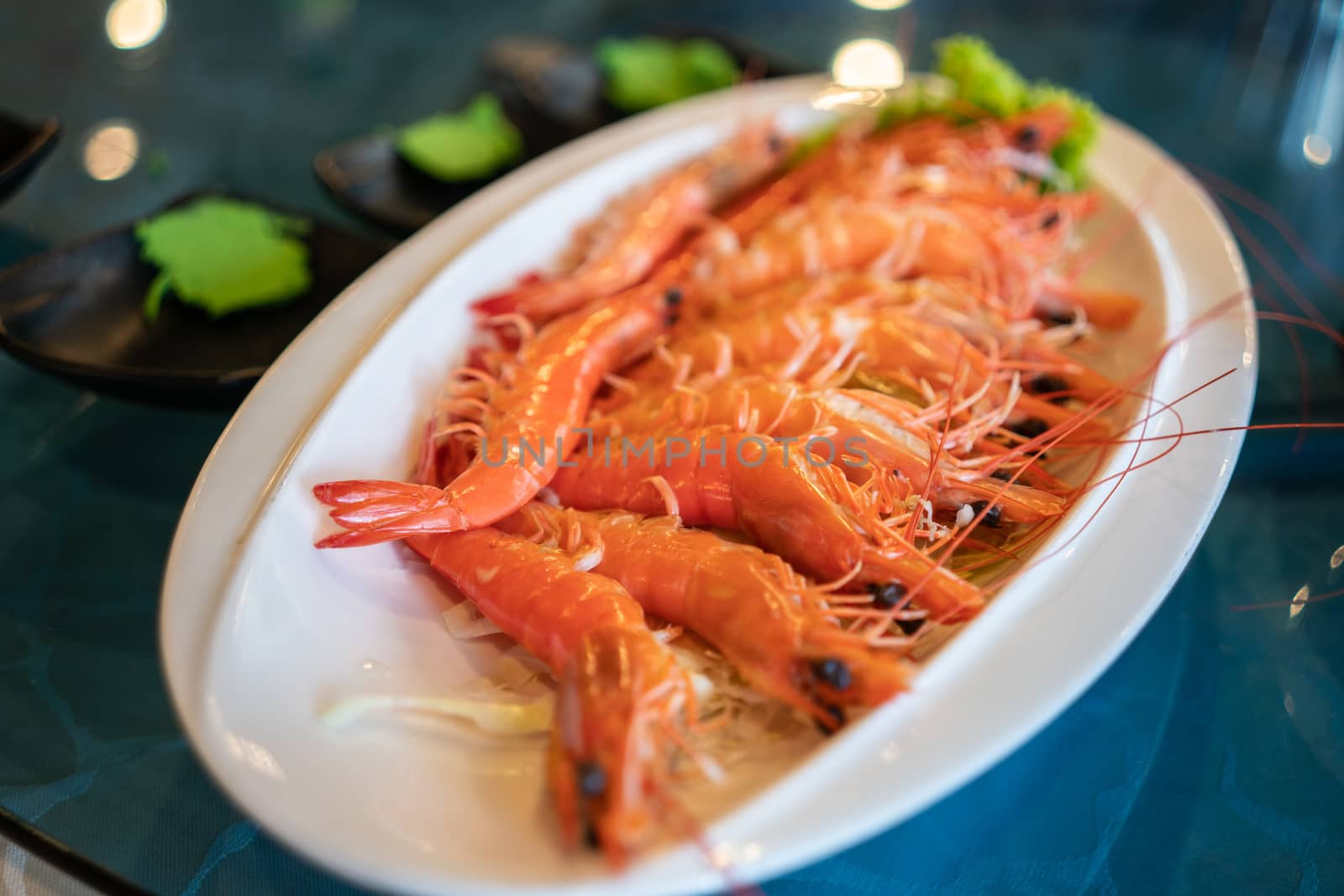 A plate of freshly cooked prawns in a restaurant