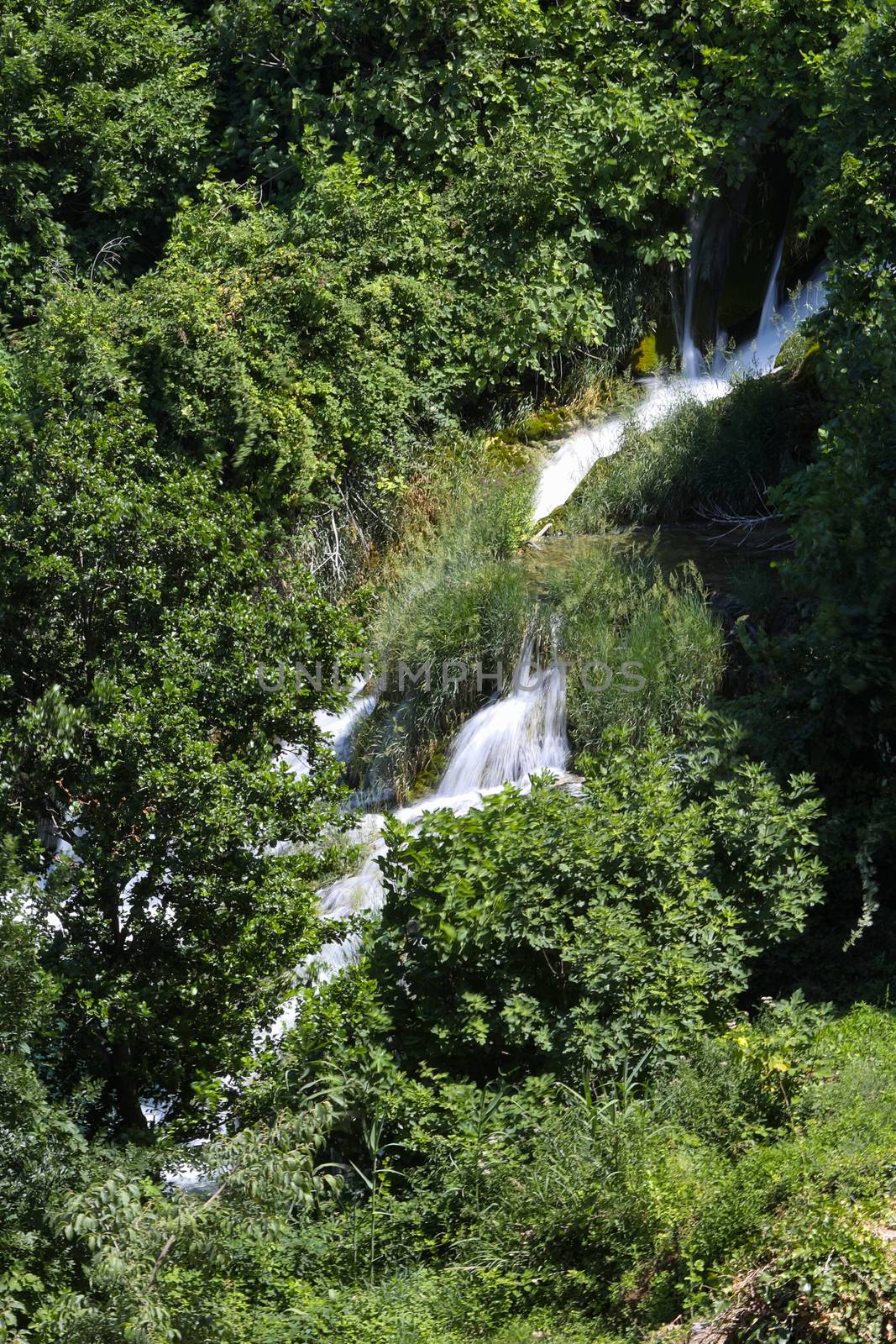 Diagonal view on waterfall in the mountain lake in the national park of Croatia by tema_rebel