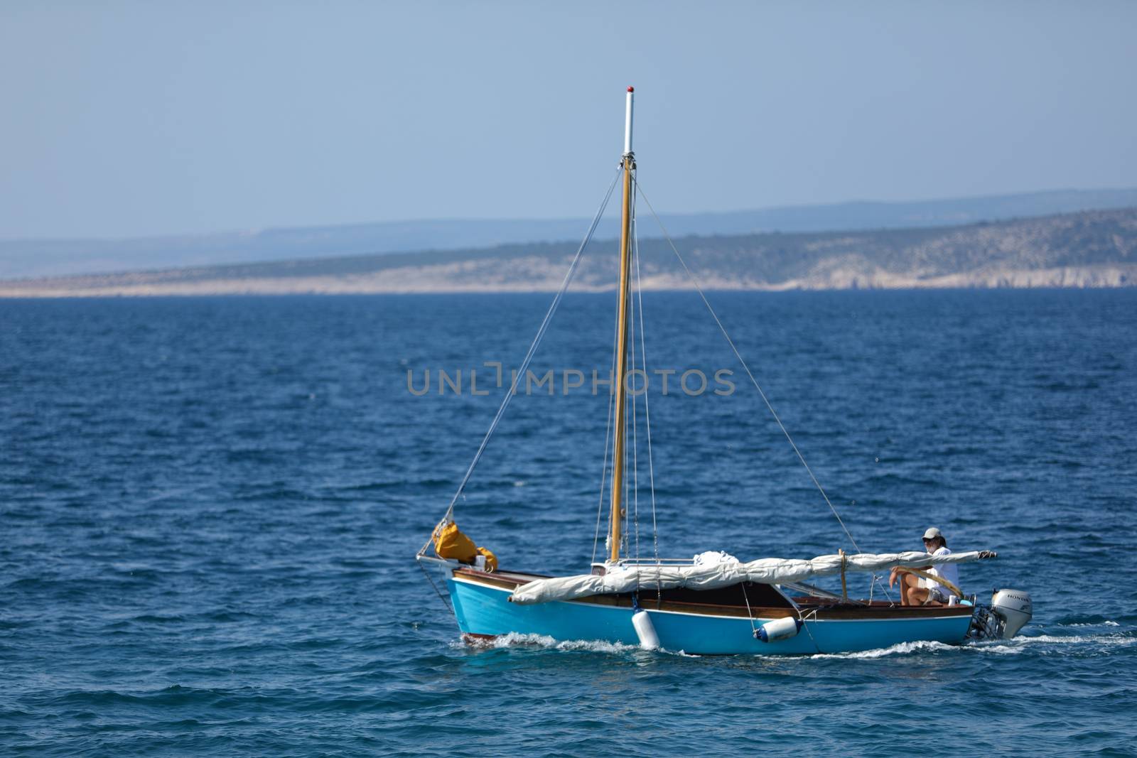 Small launch boat with people, blue sea and sky by tema_rebel