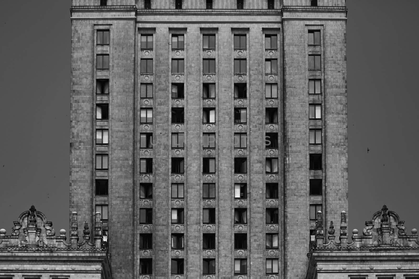 Black and white front of residential building in Warsaw. Vertical patterns, lines, abstract