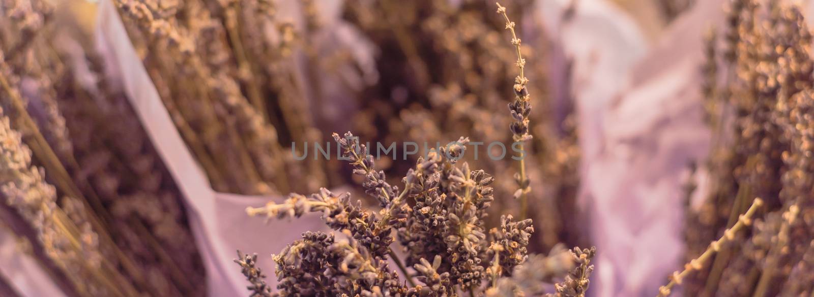 Filtered image lavender bouquet in paper wrap at local shop in Texas, USA by trongnguyen