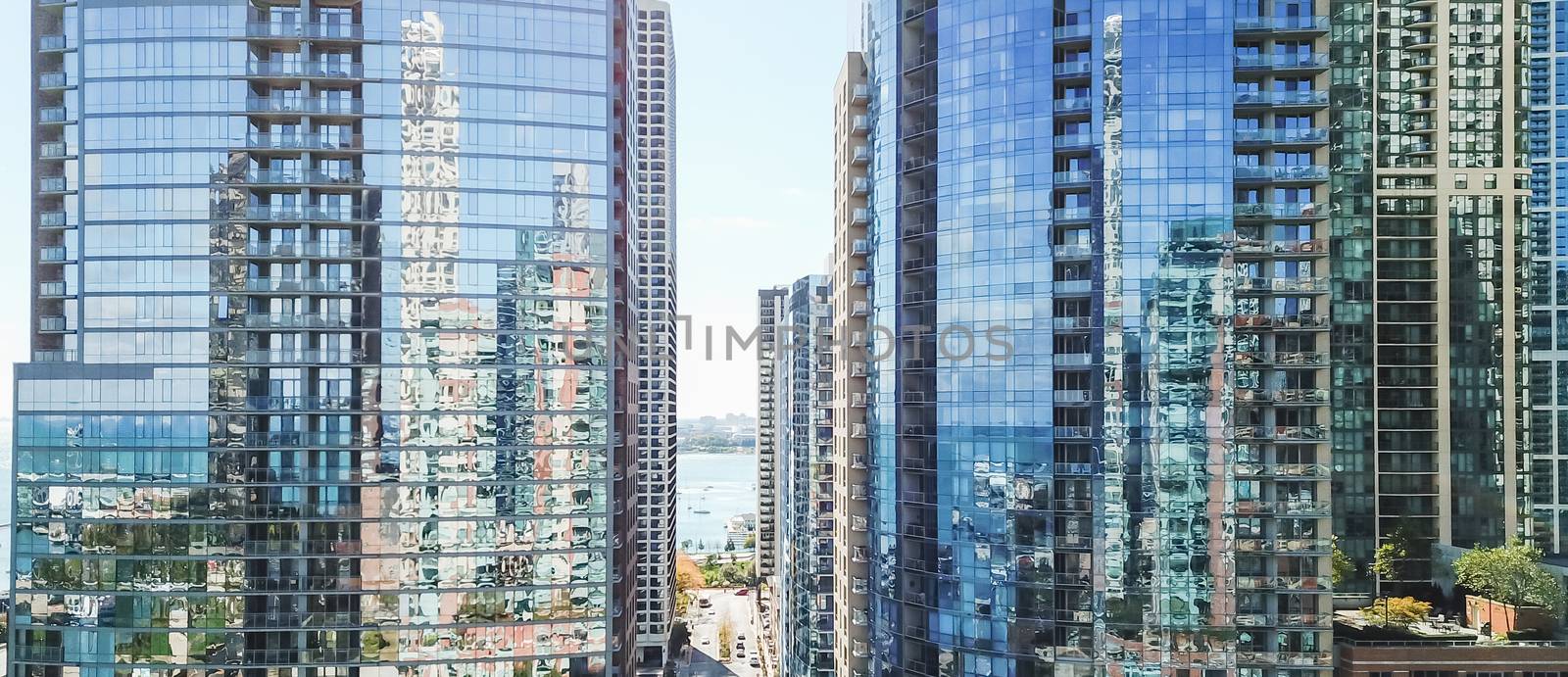 Panorama drone close-up view of Chicago skyline offices and commercial buildings along riverside