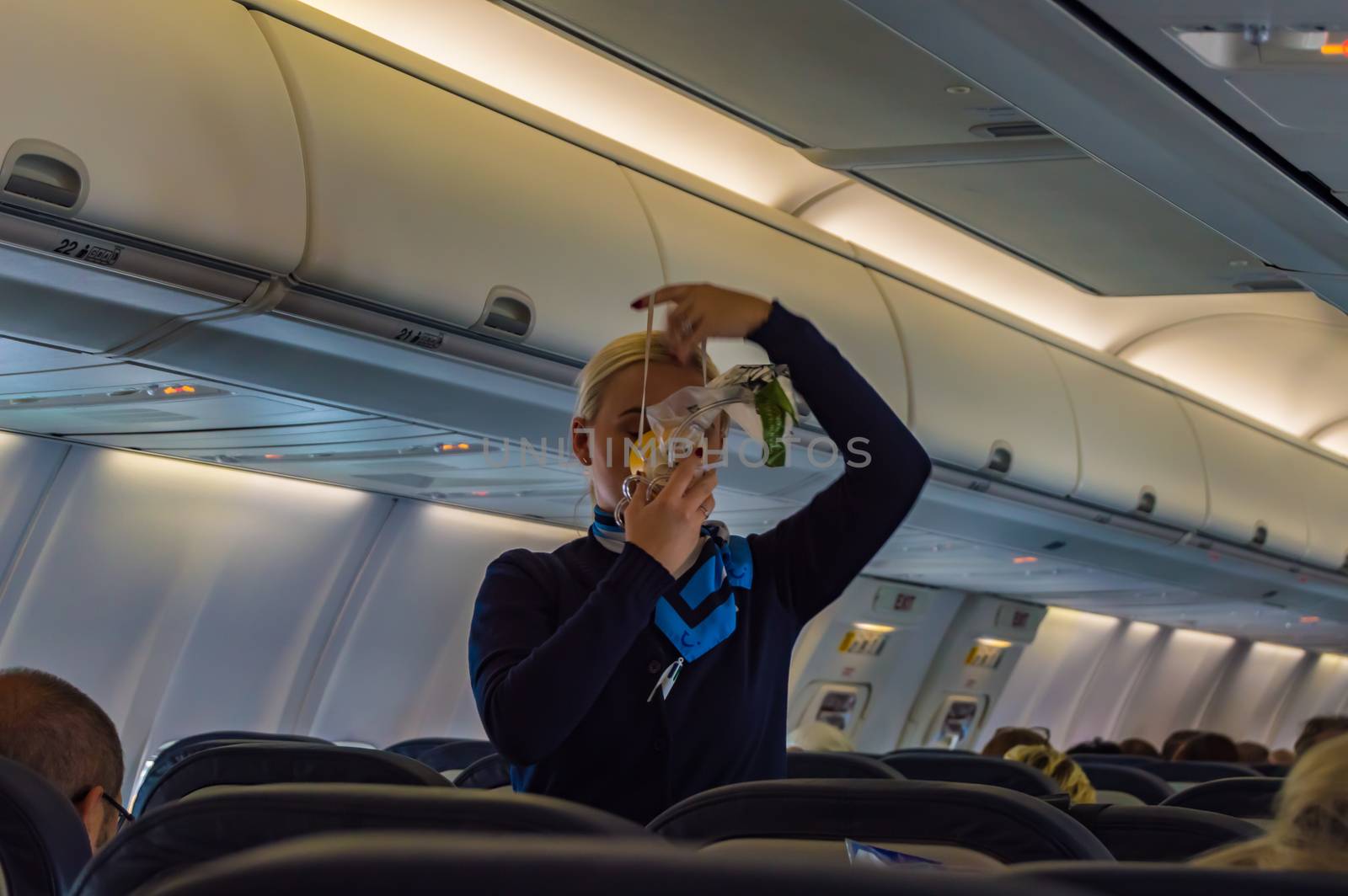 Palma - Spain 18 avril 2019: air hostess shows how to use an oxygen mask on board.