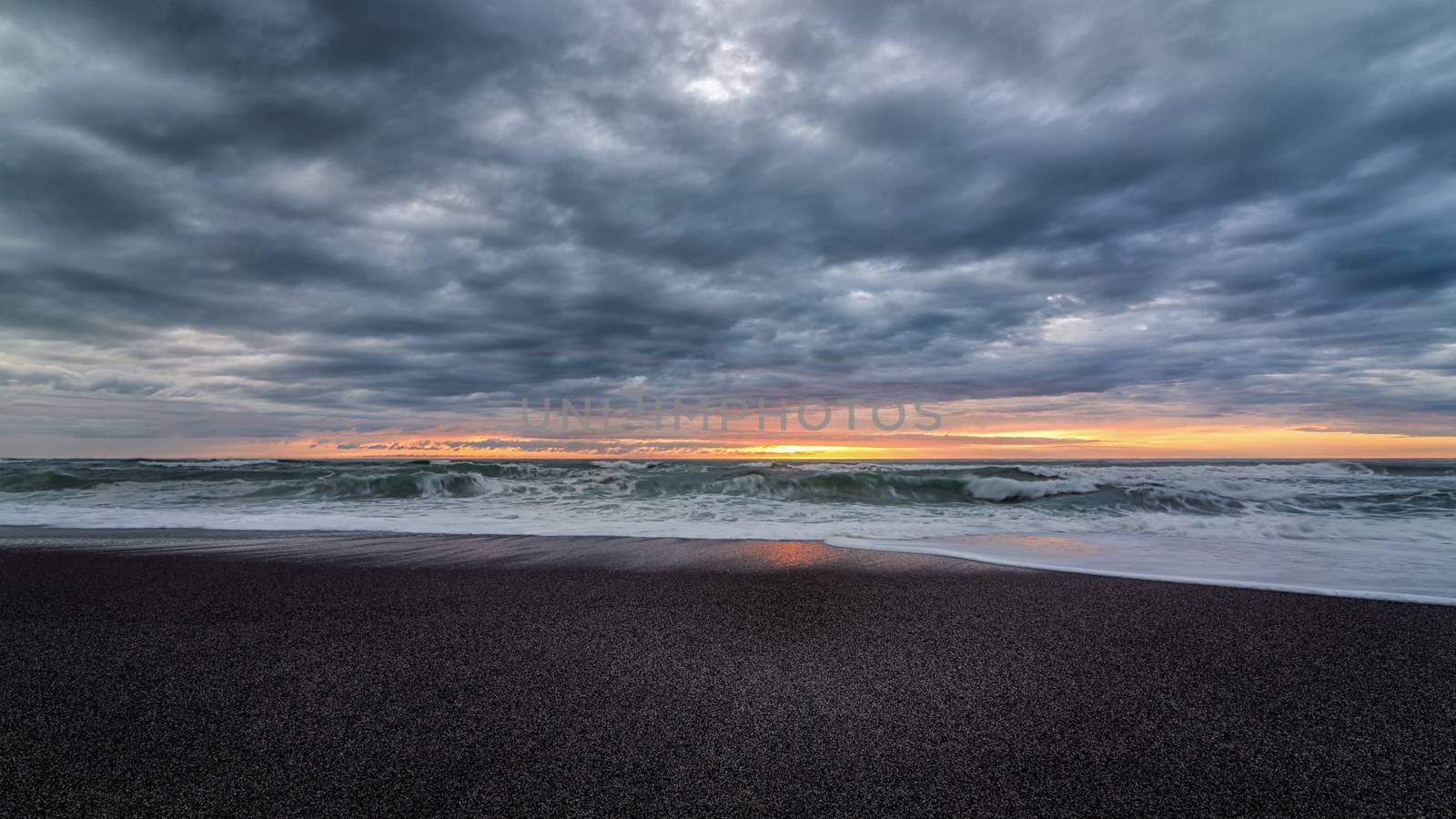 A very colorful and dramatic sunset over the Pacific Ocean.