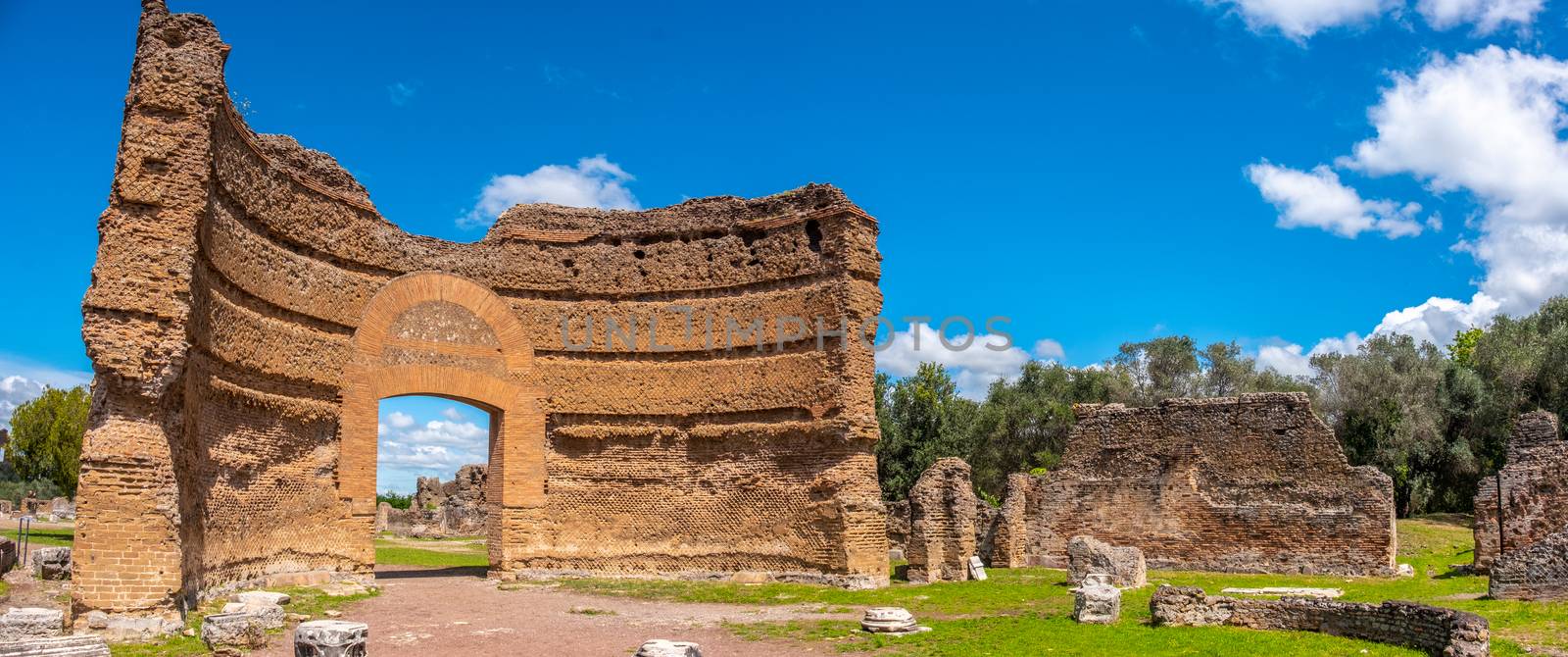roman ruins panoramic Villa Adriana in Tivoli Rome - Lazio - Italy crumbled gate of the Ninfeo palace .