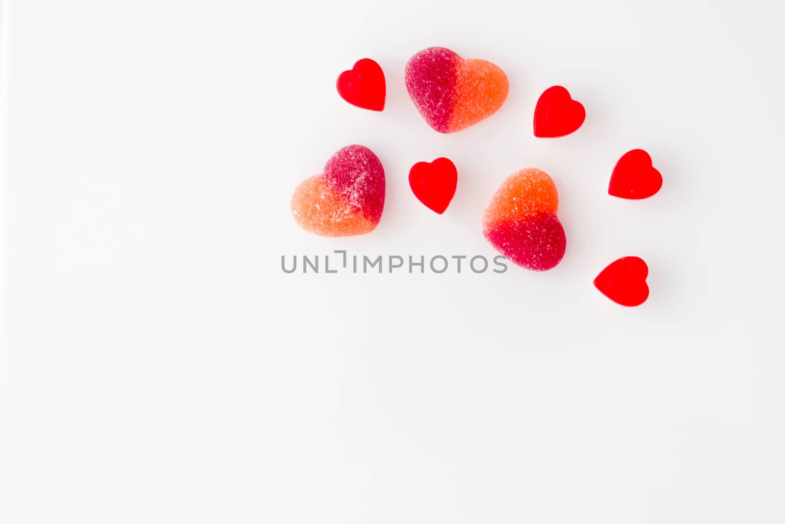 candy from marmalade in the form of red hearts by alexandr_sorokin