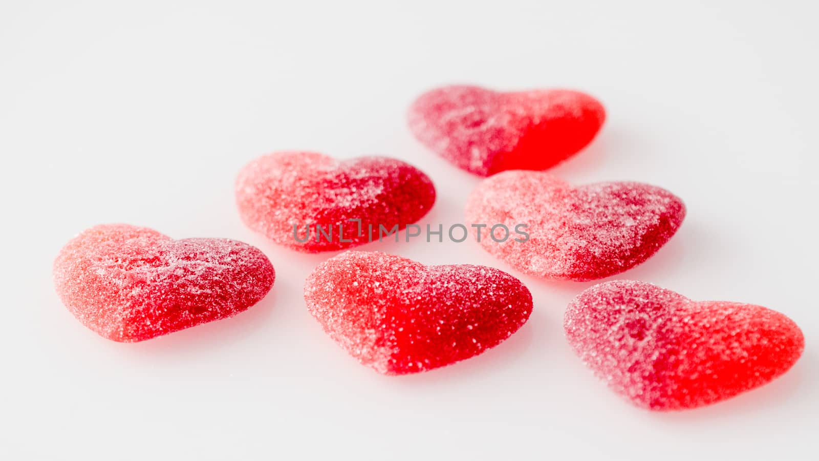 candy from marmalade in the form of red hearts by alexandr_sorokin