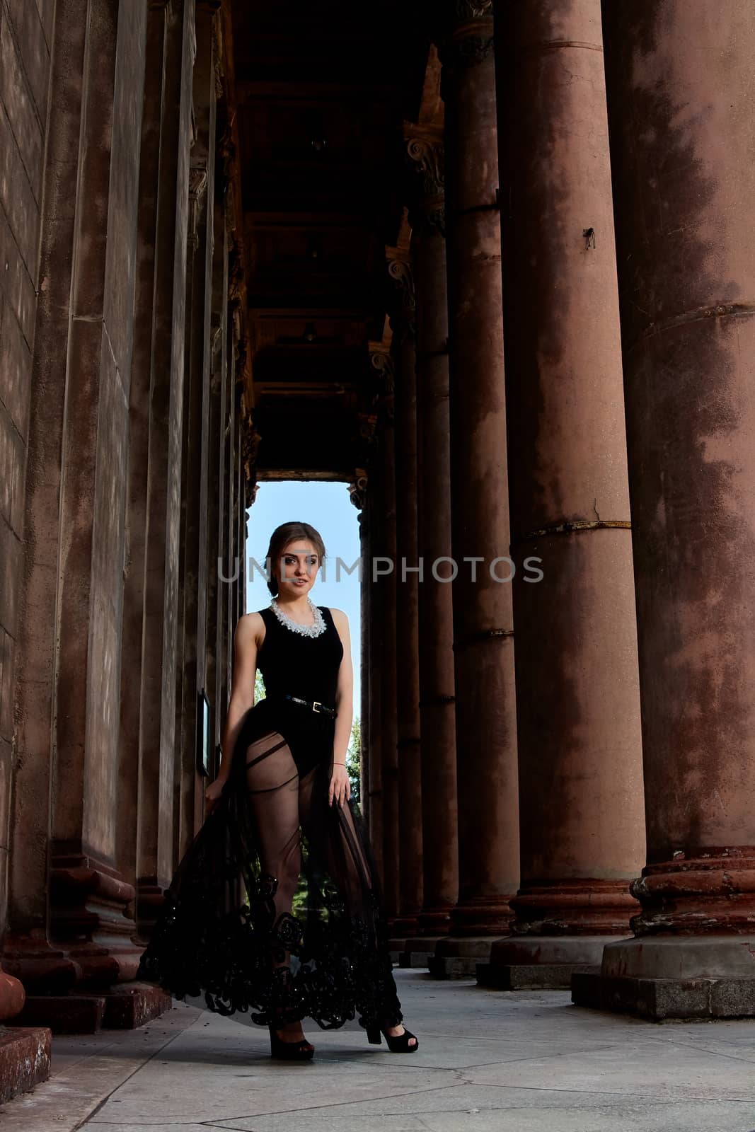Young woman is wearing a sexy transparent black dress. Young woman modern portrait. by nixrenas