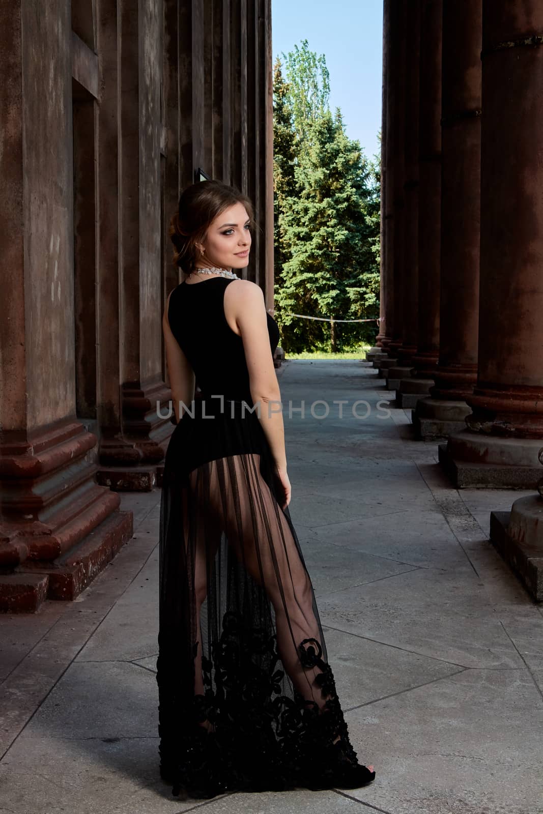 Young woman is wearing a sexy transparent black dress. Young woman modern portrait. by nixrenas