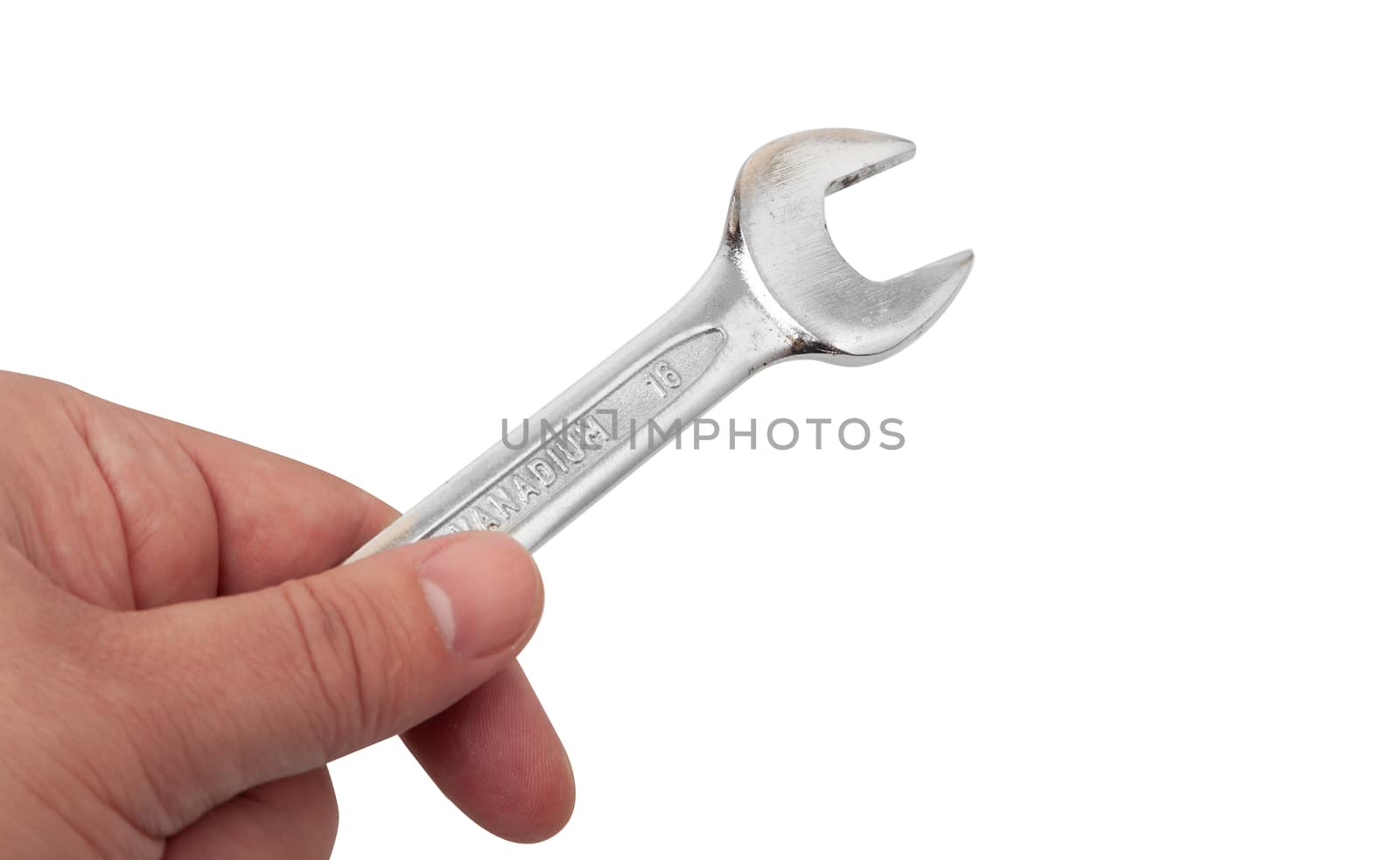 Close-up shot of a hand holding a wrench, isolated on white. With clipping path