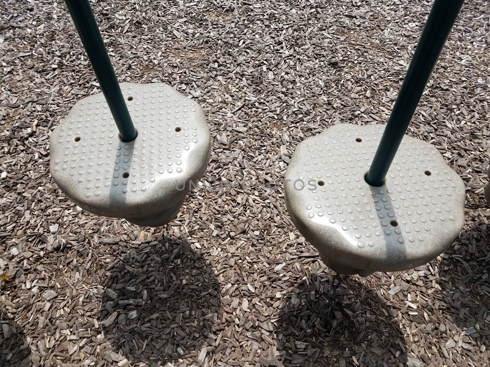 circular plastic platform with metal pole at playground by stockphotofan1