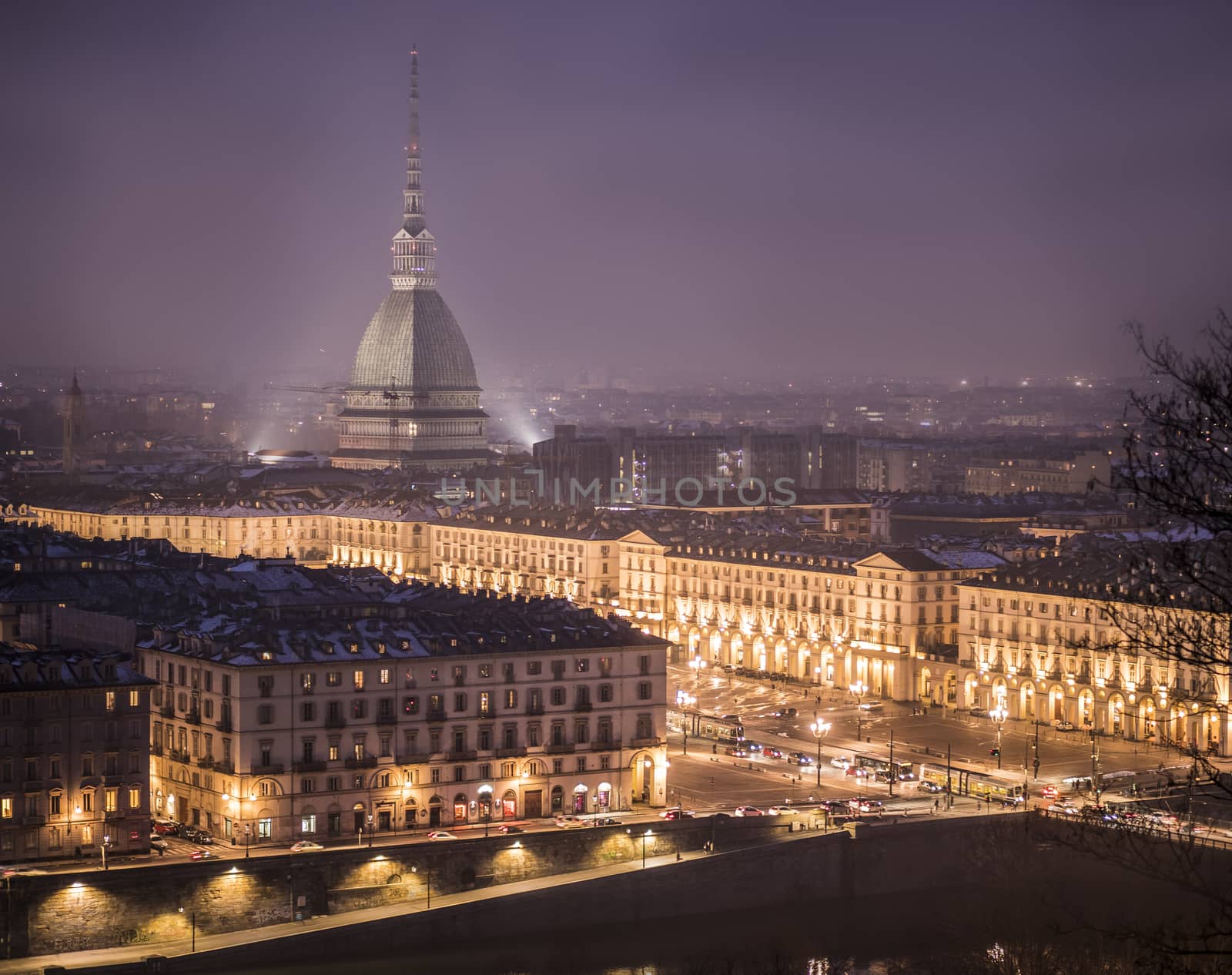 Piazza Vittorio Veneto in Turin, Italy, at night with Mole Antonelliana in the back