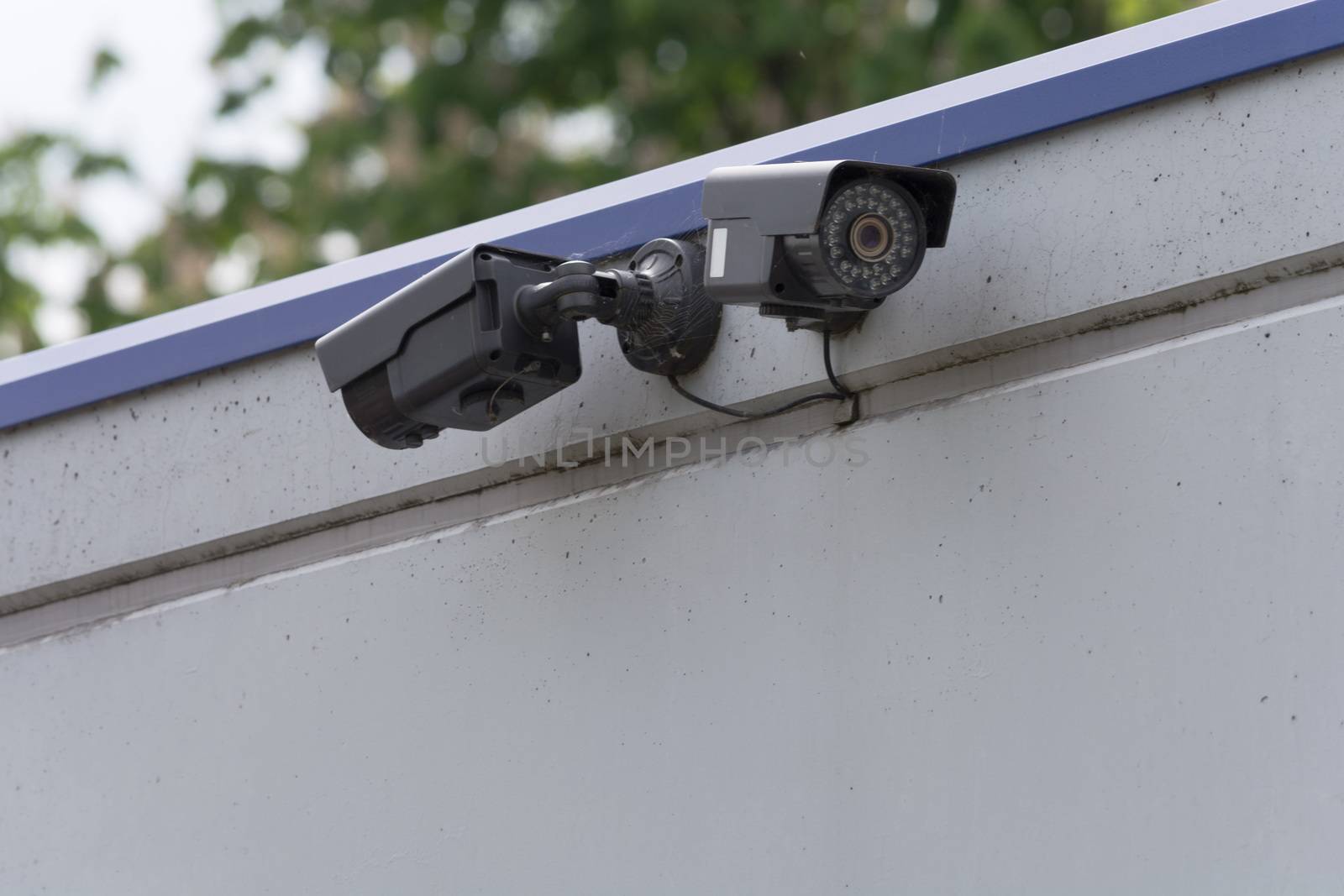 Security camera on building by JFsPic