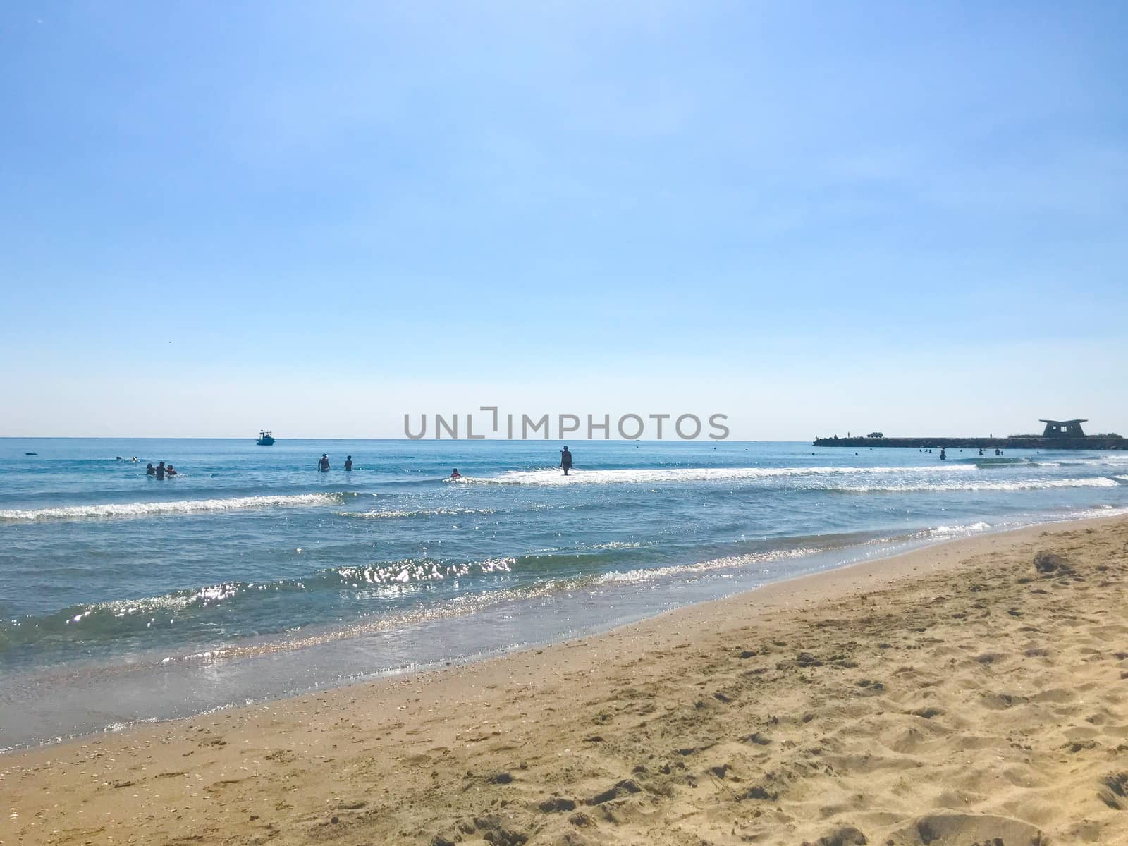 Pomorie, Bulgaria - June 05, 2019: People Relaxing On The Beach. by nenovbrothers