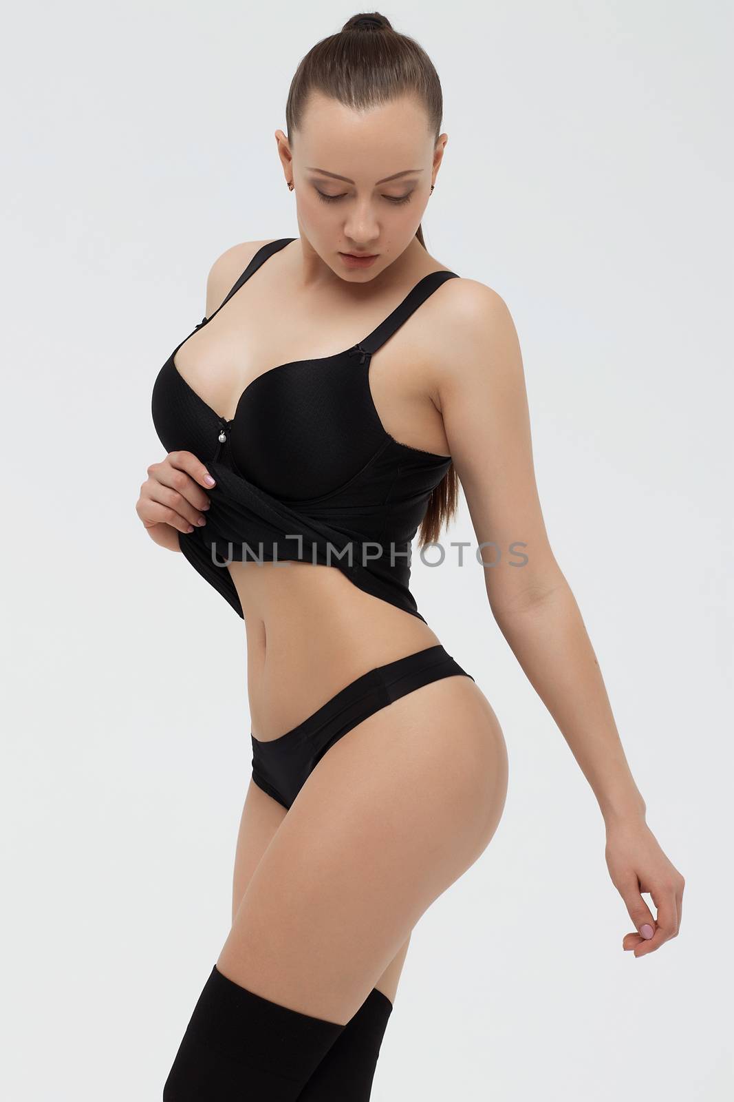 Beautiful young girl showing her breasts