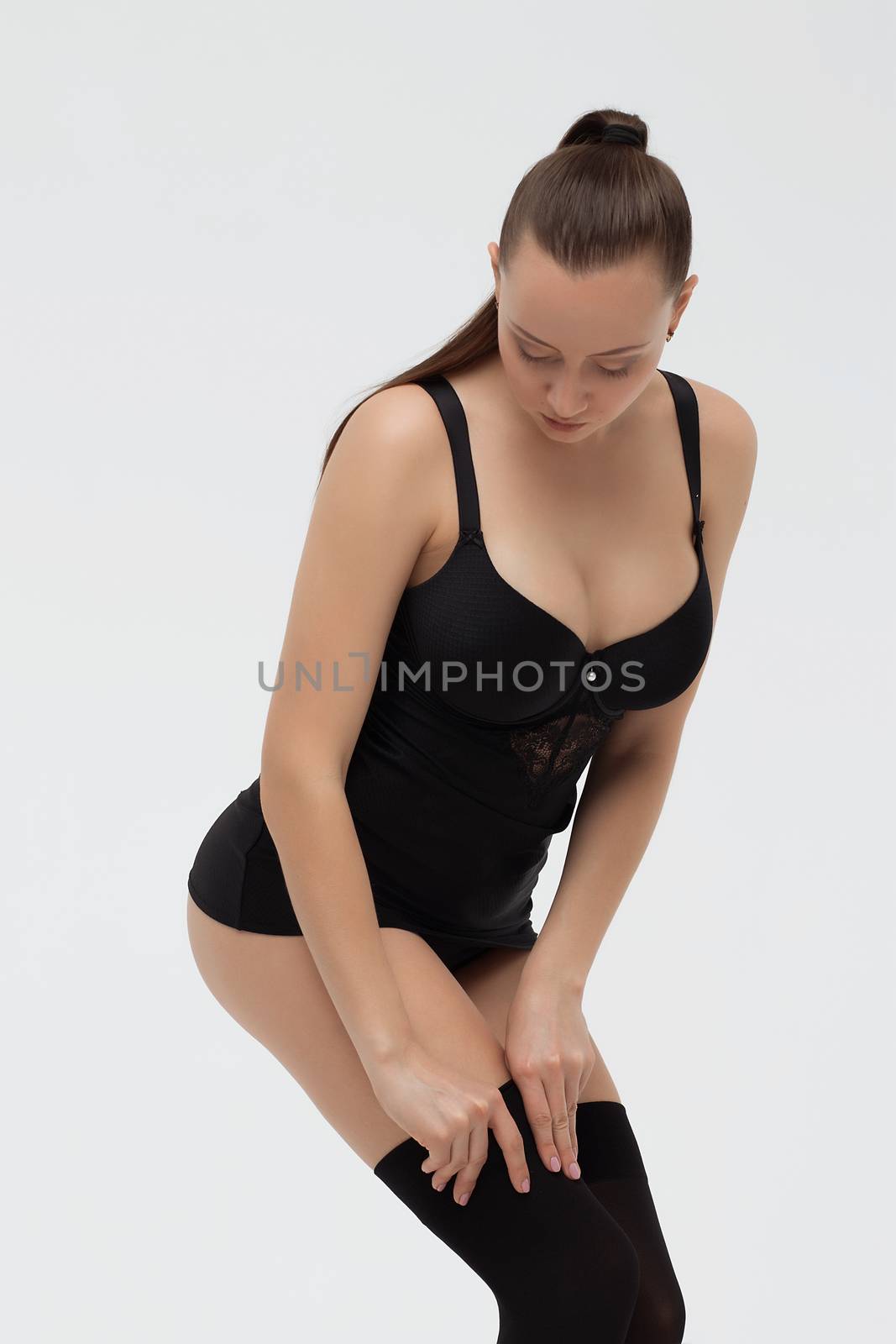 Beautiful young girl showing her breasts